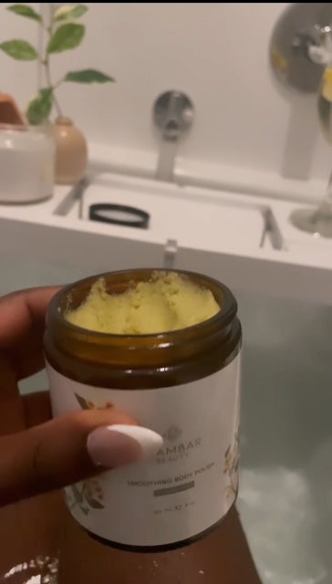 An open jar of Kinkeliba Smoothing Body Polish showcasing its rich, exfoliating texture
